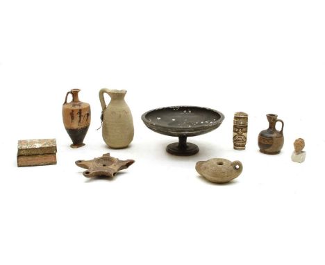 A Roman oil lamp and other antiquitiesCondition report: Box: loose top and loss to finishEwer: foot damaged half missingJug: 