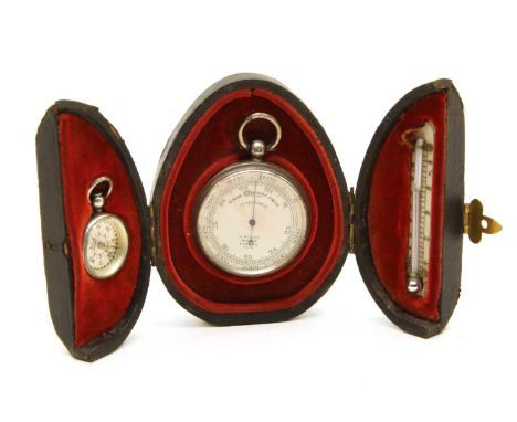 A silver mounted travelling barometer, compass and thermometer, mounted in a velvet lined leather pocket case, the barometer 