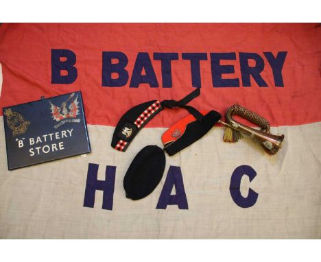 Two boxes of military items, including copper bugle, marked 'Essex', with The Essex Regiment crest, cloth badges and stripes,