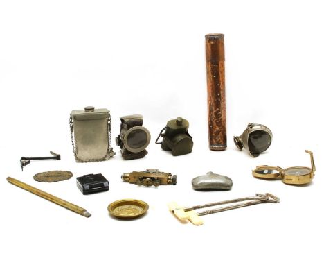 A box of metal items, including Lucas 'Petroleum Silver King' acetylene cycle lamp, army torch, Clinometer Sight Mk lV, bakel