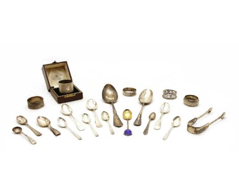 A collection of silver flatware and napkin rings, to include an early Georgian spoon, a cased silver napkin ring, London 1929