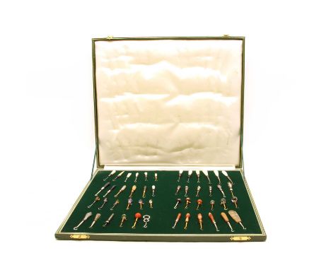 A cased collection of button hooks with various handles, with various handles to inlcude agate, silver, mother of pearl and e