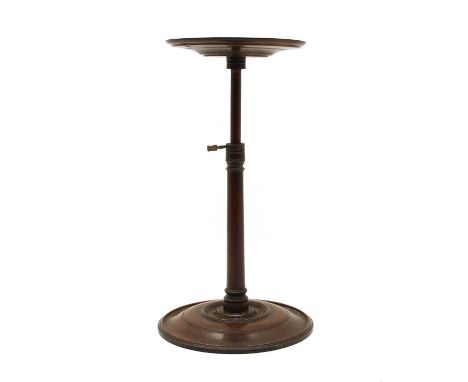 A small early to mid 19th century mahogany adjustable candlestick stand, with lead weighted base. 26cm high closed, 43cm high