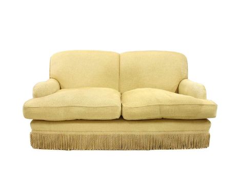 A pair of contemporary two-seater sofas, in the manner of Howard and Sons, upholstered in yellow Nina Campbell fabric, with s