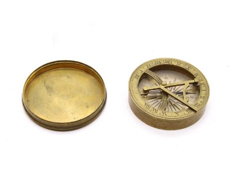 A George III brass pocket sundial and compass, with hinged gnomon, 6.7cm diameter, with photocopy of the original Beckwith &a