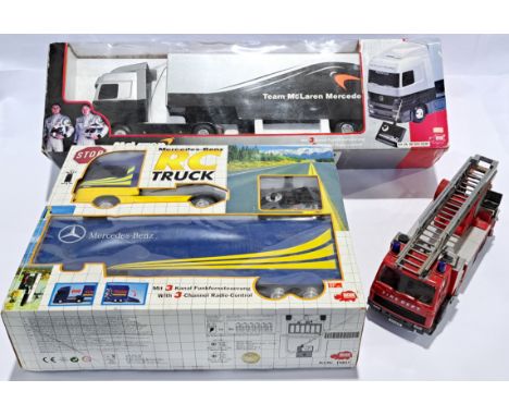 Dickie Spielzeug, a boxed radio controlled truck pair &amp; fire engine. Although untested and unchecked for completeness, co