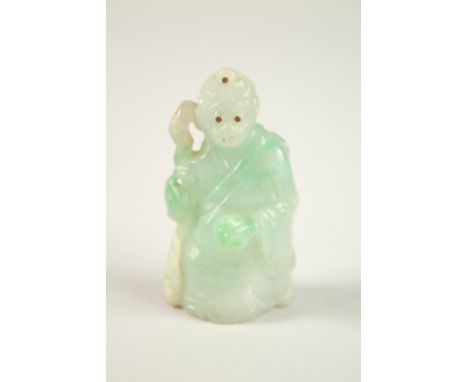 A FINE CHINESE CARVED JADE MONKEY IMMORTAL, with inlaid eyes and headpiece, 6cm high.