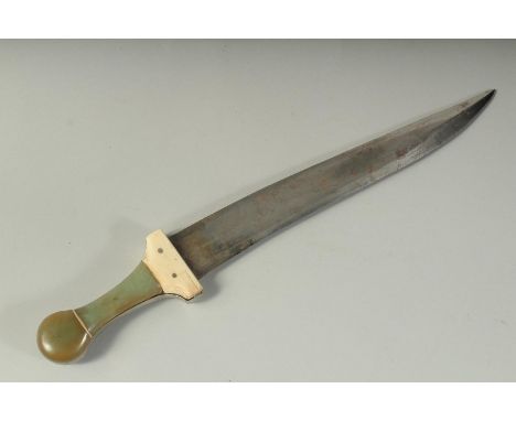 A FINE AND LARGE INDIAN JADE AND BONE HILTED DAGGER, with watered steel blade. 40cm long.