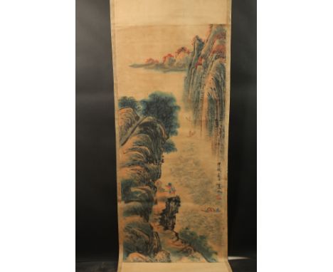 A CHINESE SCROLL PAINTING ON PAPER, depicting a mountainous landscape, inscribed and with red seal, 132cmx 57cm.