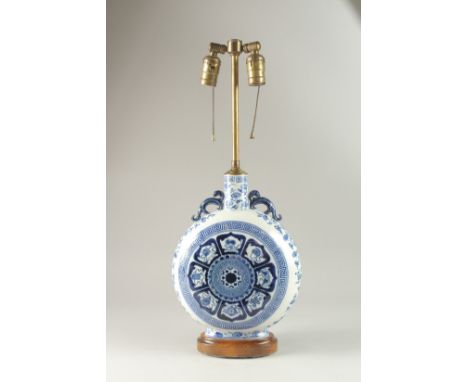 A CHINESE BLUE AND WHITE PORCELAIN MOON FLASK LAMP, decorated with luck symbols, 59cm high overall.