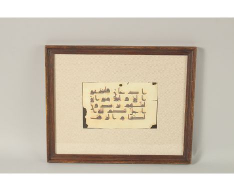 A DOUBLE-SIDED KUFIC CALLIGRAPHY MANUSCRIPT PAGE, framed and glazed.