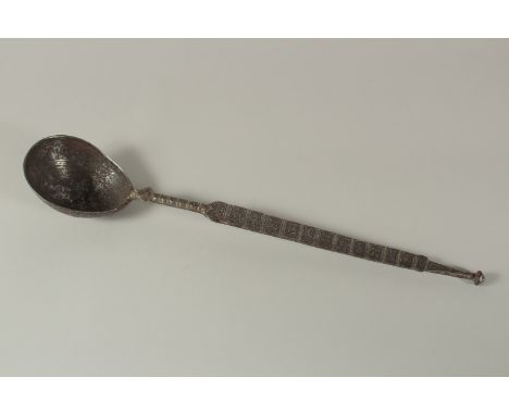 A LARGE RARE 11TH-12TH CENTURY PERSIAN SELJUK ENGRAVED IRON LADLE, with Kufic calligraphy and animals, 47cm long.