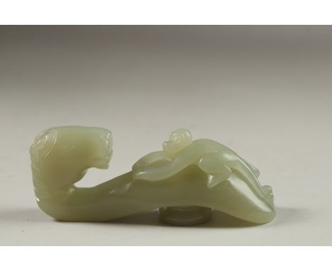 A FINE CHINESE CARVED JADE HORSE AND MONKEY BELT HOOK, 9cm long.