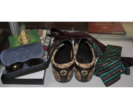 Three vintage Gucci wallets in fabric and green leather, a pair of gentlemans Gucci shoes, a pair of Gant sunglasses, a Gucci