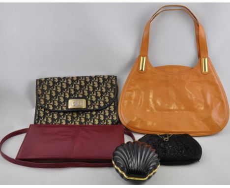 A collection of 11 ladies vintage handbags and purses including examples by Dior, Gucci, Charles Jourdan and Salato