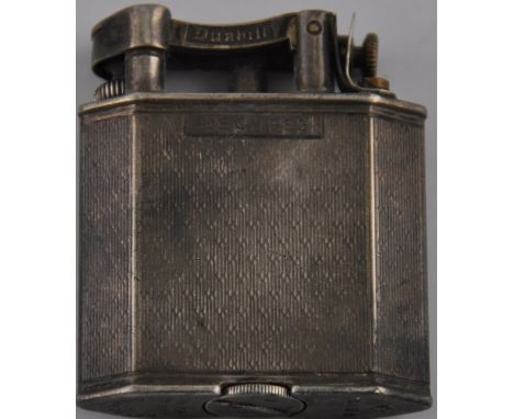 A Dunhill 'Unique' silver cased petrol lighter, London 1936, with engine turned body, catouche engraved Dec. 1953. patent no.