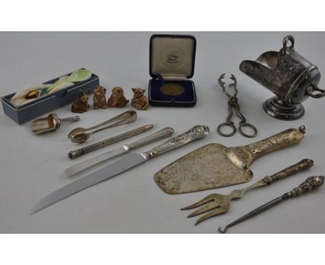 Two George V silver handled button hooks, ten silver handled tea knives, a bread fork, an Eversharp silverplated propelling p