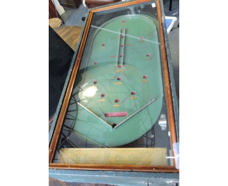 'The Wizard Pin Game' table-top bagatelle board, rectangular with a glass top and green rexine case, L. 64cm.