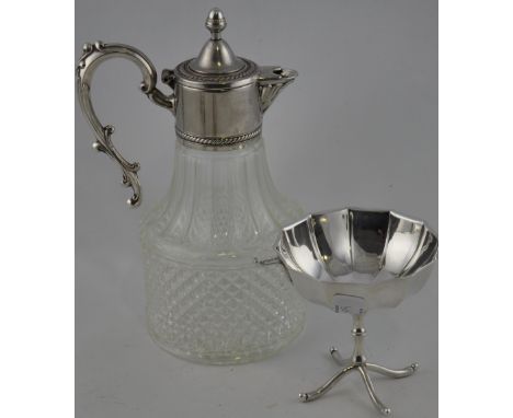 A vintage white metal mounted claret jug, with a hob-nail cut body, H. 26cm, together with a faceted dish on turned support a