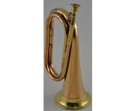 A military style copper and brass bugle trumpet