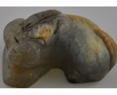 A Nephrite jade carving of a Chinese temple lion