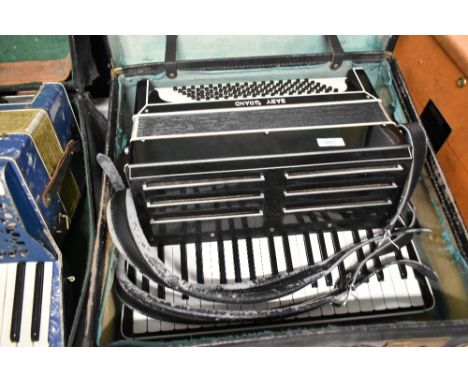 A vintage Baby Grand piano accordion, with case