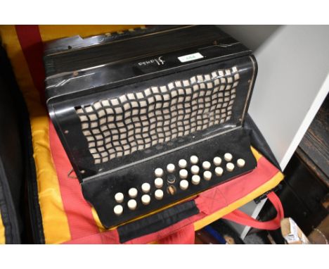 A vintage Schlossinetrel button accordion , sold with later accordion case (German)