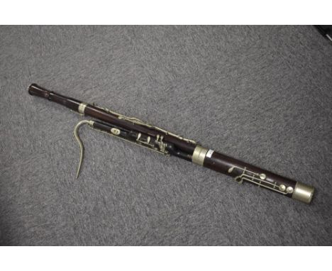 An early 20th Century Boosey &amp; Co rosewood bassoon , serial number 21596, circa 1915