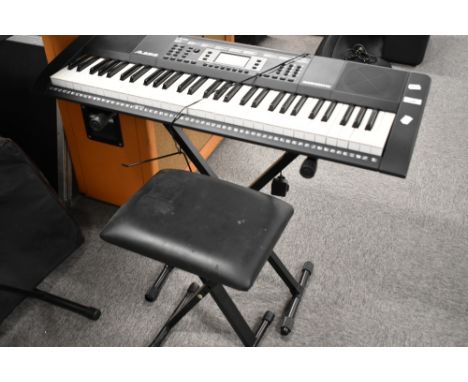 An Alesis Harmony 61 electronic keyboard, with stand and stool