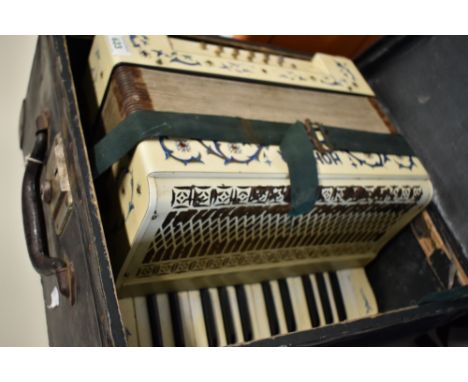 A Hohner piano accordion in hard case