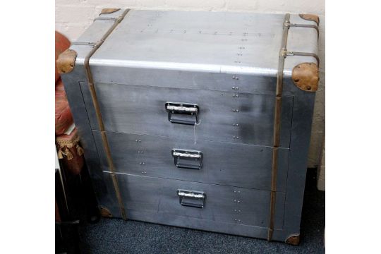 An Aviation Style Chest Of Drawers With An Aluminium Finish And