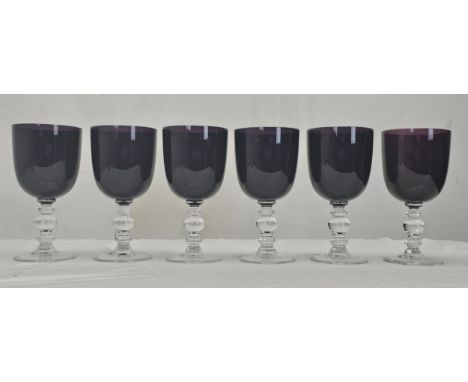 A set of six William Yeoward amethyst coloured crystal wine glasses with clear stems. Note that one (on the right) is ever so