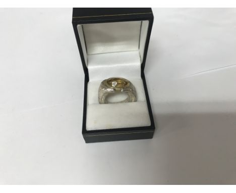 A silver &amp; 18ct gold ring set with a large citrine Size K (a)