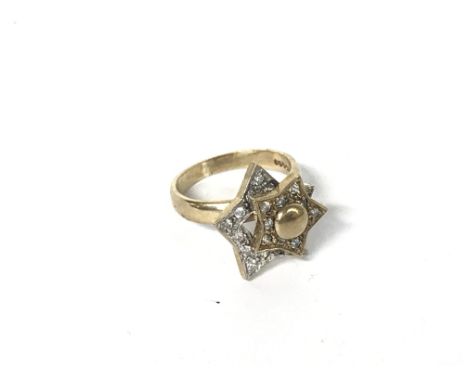 9ct gold diamond stars ring, 5.6g size L/M. Category A postage