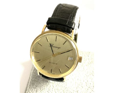 A vintage 9ct gold Bassange quartz watch with date aperture, (A).
