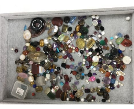 A bag of mixed stones including jade, pearls, quartz and other stones. Shipping category A.