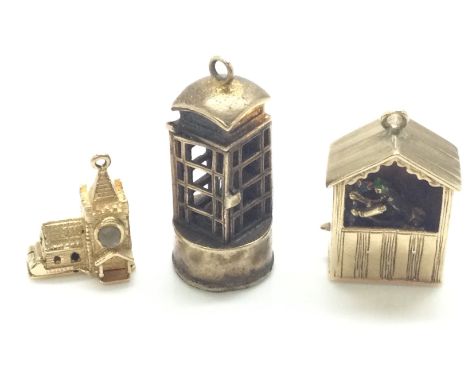 3 Unusual hallmarked 9ct gold charms consisting of a church viewer, telephone box light, working Punch and Judy charms. Combi