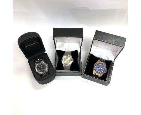Three watches, one Dunlop, one mini focus and one Armani watch, all seen working. Shipping category B.