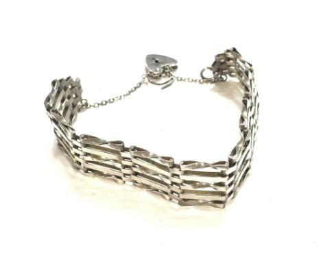 A silver gate bracelet 20mm wide. Total weight 19gPostage B