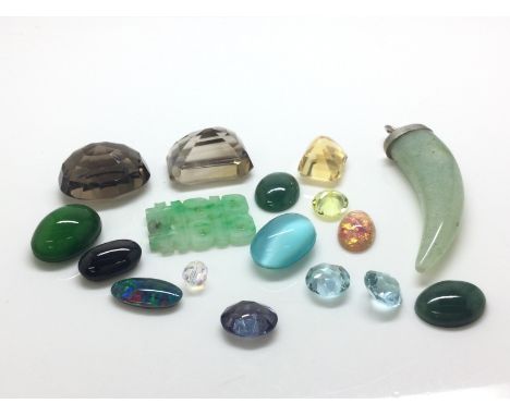 A collection of Mixed semi precious stones including jade stones. (A).