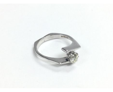 An 18ct white gold solitaire diamond ring, approx .25ct, approx 3.3 g and approx size J. Shipping category A.