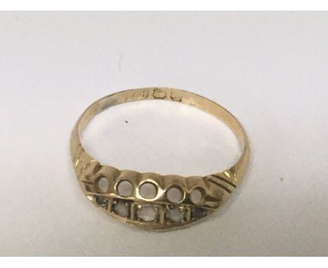 An 18carat gold ring set with chip stone diamonds ring size L.