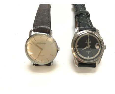 Two vintage gents watches including a Titoni air master and a Tho Russell and sons. Both seen running.Postage B.