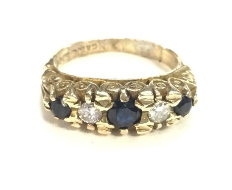 A 9ct gold sapphire and diamond ring. Size I1/2 and 4.30g total. Postage A.