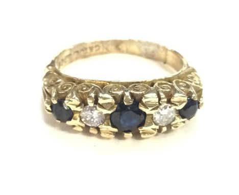 A 9ct gold sapphire and diamond ring. Size I1/2 and 4.30g total. Postage A.