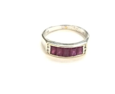 An 18ct white gold ruby and diamond ring. Size N and 3.60g. Postage B.