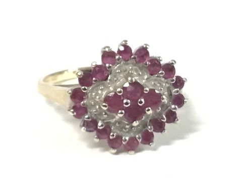 9ct gold ruby and diamond cluster ring, size R. 4.4g