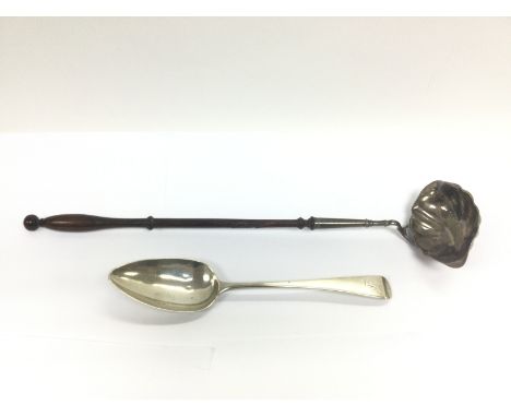 A late Victorian silver toddy ladle and a George III silver spoon (2). Shipping category B.