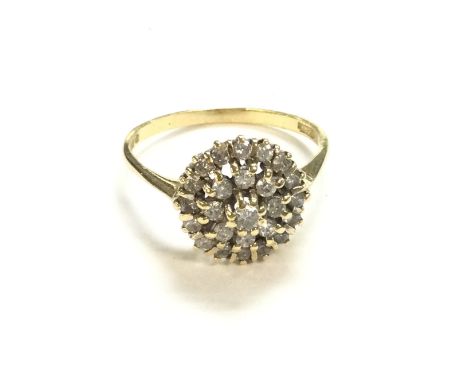 An 18ct gold diamond cluster ring. Size S and 3.78g. Postage A.