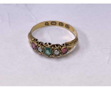 An Antique 12 carat gold ring with multi stone setting with ruby seed pearl ring size J.